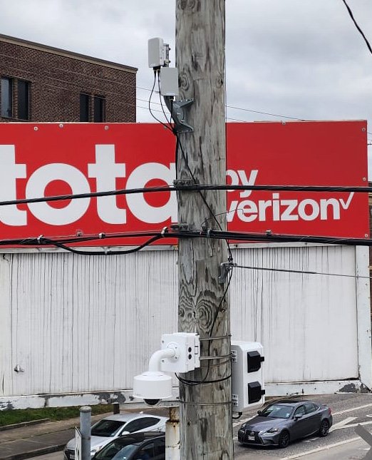 K60 radio and camera on pole at Verizon storefront