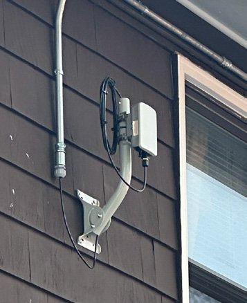 K60 radio on brown siding